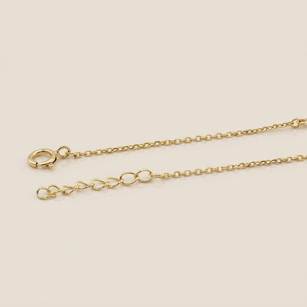 Pulsera Ojo y Cruz con Circonias en Oro Amarillo de 14K